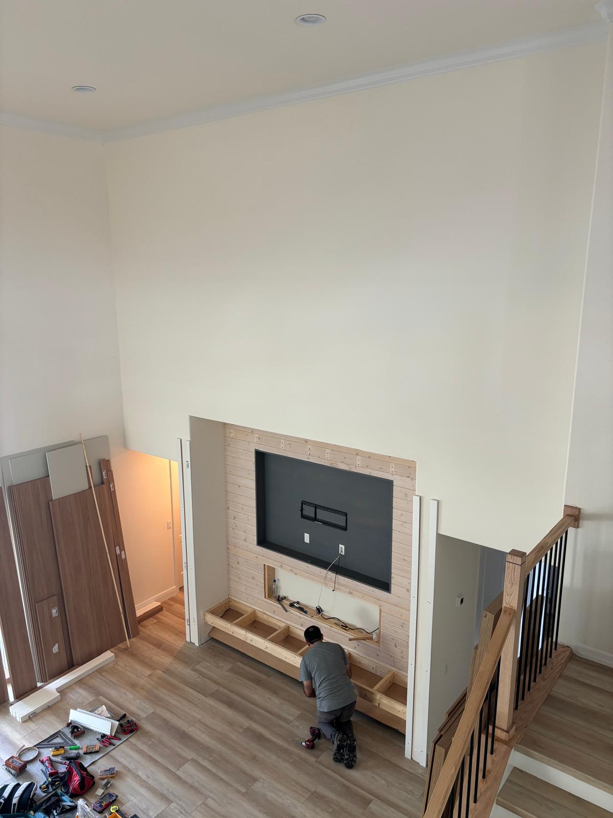 Living room media wall renovation — before